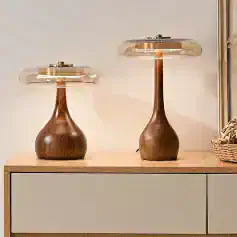 Elegant wooden table lamps with glass shades, perfect for modern home decor and interior lighting. Designed to add a touch of sophistication to your living space.