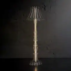 Metallic decorative floor lamp with modern design and unique structure, ideal for contemporary interior decor, available at Monalisa Medical Store.