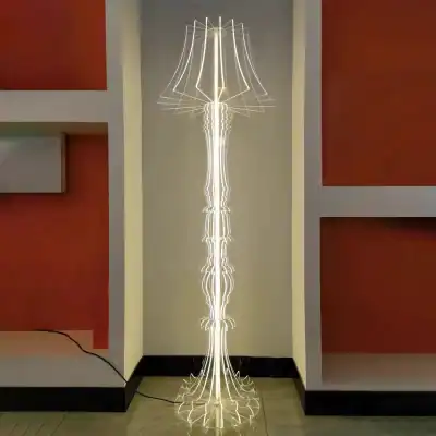 Modern LED floor lamp with a unique sculptural design, perfect for stylish living spaces and enhancing room ambiance.