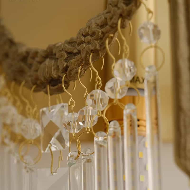Elegant crystal and gold jewelry display featuring intricate hanging accessories at Monalisa Store for luxury jewelry shopping and stunning design.