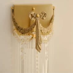 Delicate gold and beige decorative wall hanging with beaded accents, perfect for vanity or elegant decor in opt clinic.