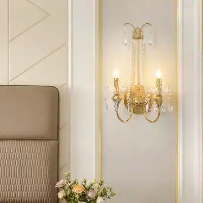 Elegant gold wall sconce with crystal accents, perfect for enhancing luxury interior decor in opt clinics and medical spaces.