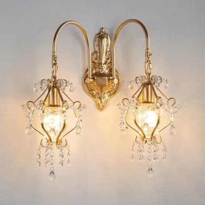 Elegant gold wall sconce with crystal accents, perfect for luxury interior lighting and decor. Ideal for enhancing living rooms, bedrooms, or hallways with a touch of sophistication.
