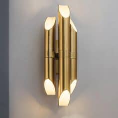 Brass wall sconce light fixture, modern minimalist design, elegant indoor lighting for homes and hotels, Monalisa Store skincare and beauty products, luxurious bathroom and living room decor.