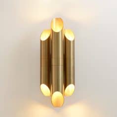 Modern gold LED wall sconce lighting fixture with sleek cylindrical design, ideal for sophisticated interior decor and enhancing ambient lighting in stylish spaces.