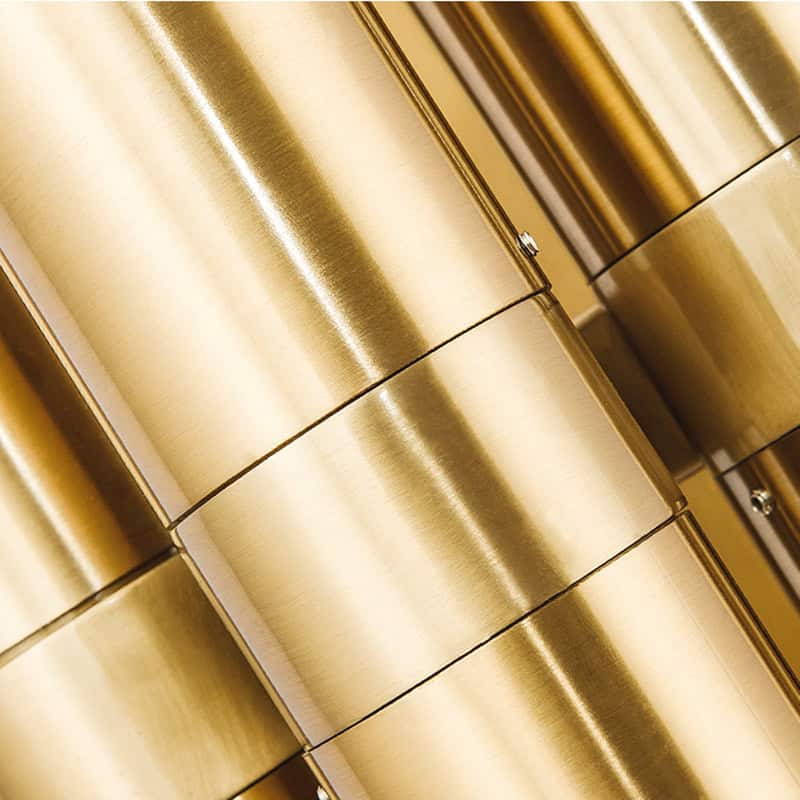 Gold-colored metallic containers for storage or display, with a sleek and modern design suitable for a high-end optometry or eyewear store like Monalisa Store, emphasizing luxury and quality in optical accessories.