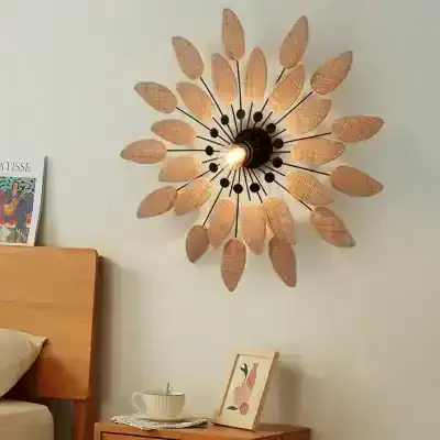Decorative wall sconce with leaf-shaped rattan design, ideal for modern home decor and lighting, enhancing ambiance and aesthetics.