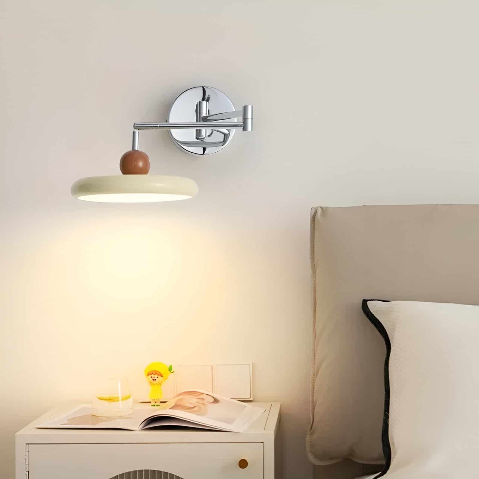 Modern bedside wall lamp with adjustable arm, sleek chrome finish, and minimalist design for bedroom decor.