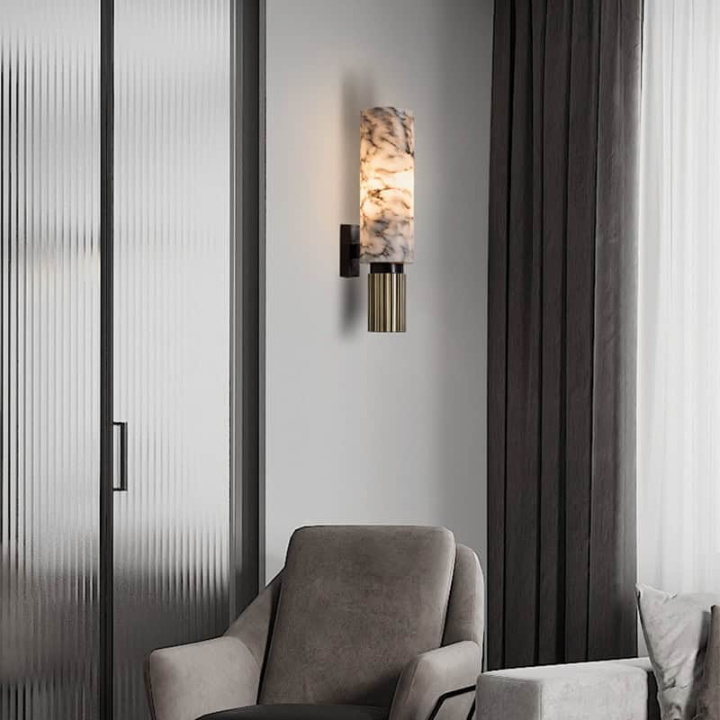 Elegant minimalist interior with a modern wall sconce, plush beige and gray chairs, and sleek design elements, ideal for optometry and eyewear retail at Monalisa Store.