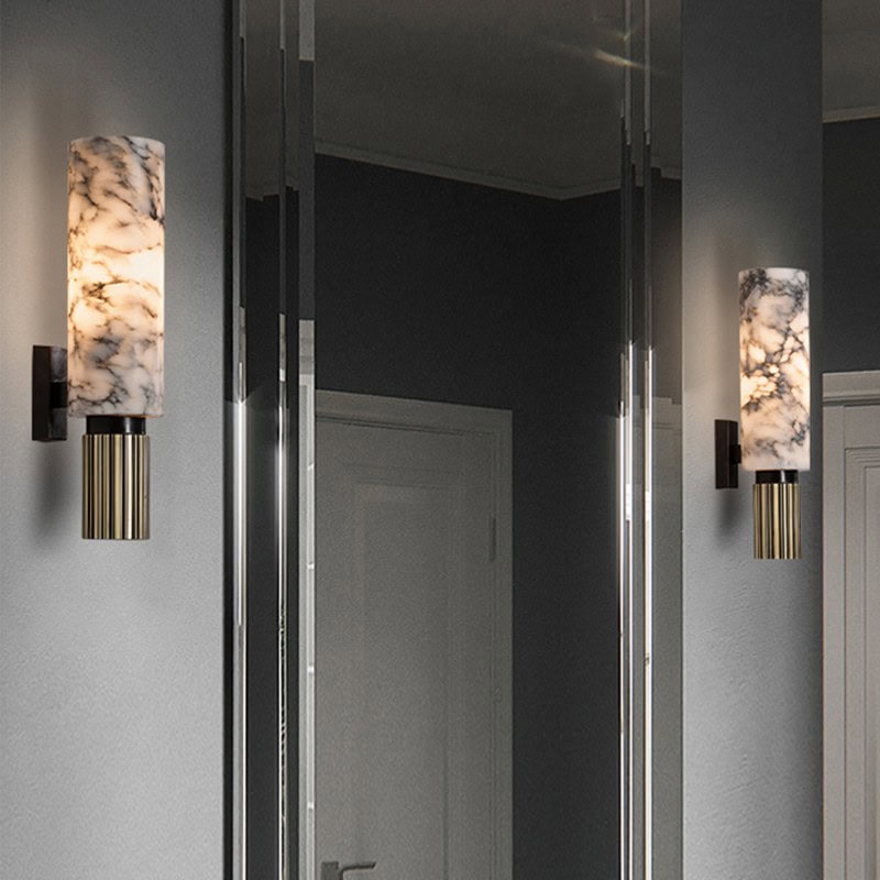 Elegant wall-mounted marble and brass sconces in modern Monalisa store decor, providing a sophisticated lighting ambiance for a contemporary optical retail space.