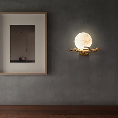 Elegant wall-mounted moon and driftwood lamp, modern art decor perfect for a sophisticated home or office space.