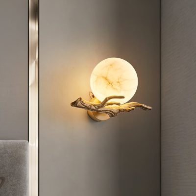 Elegant bedside wall lamp with a moon-shaped onyx globe and a wooden branch accent, ideal for stylish lighting in medical or beauty clinic settings.