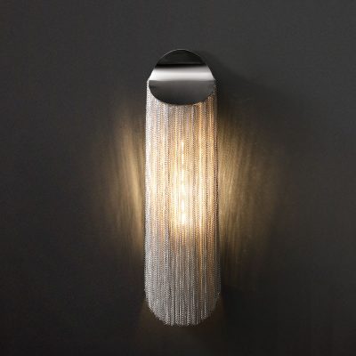 Stylish modern wall sconce with metallic chain curtain design for elegant interior lighting enhances room decor and ambiance.