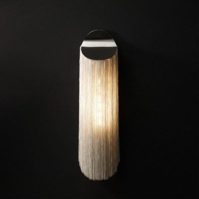 Ambient modern wall light with cascading crystal chains, perfect for enhancing luxury and elegance in optometry clinics and eye care stores.