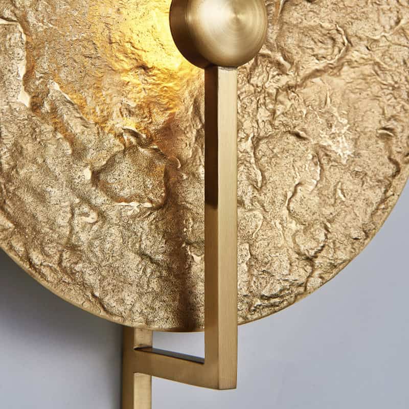 Luxury gold wall clock with textured face and modern minimalist design for elegant home decor.