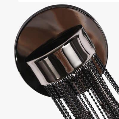Polished black vanity mirror with hanging chains, modern stylish makeup accessory for beauty and skincare routines.