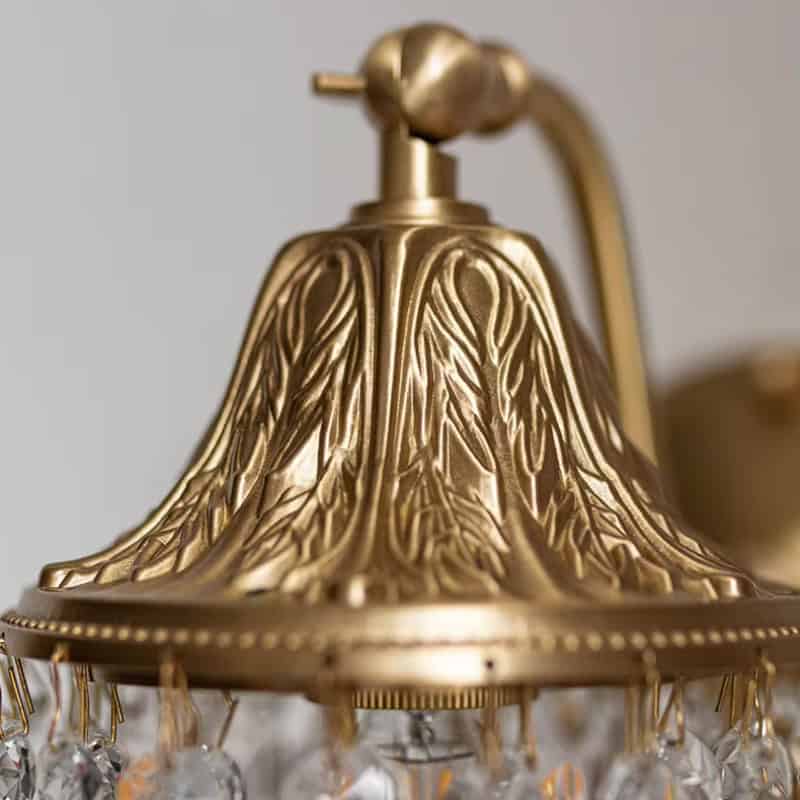 Golden chandelier with intricate leaf design and crystal accents, adding elegance to any space. Ideal for enhancing interior decor with a luxurious touch. Perfect for living rooms, dining areas, or entryways.