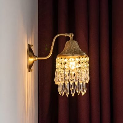 Elegant crystal wall sconce with gold finish, perfect for luxury interior decor in optometry and eyewear stores.