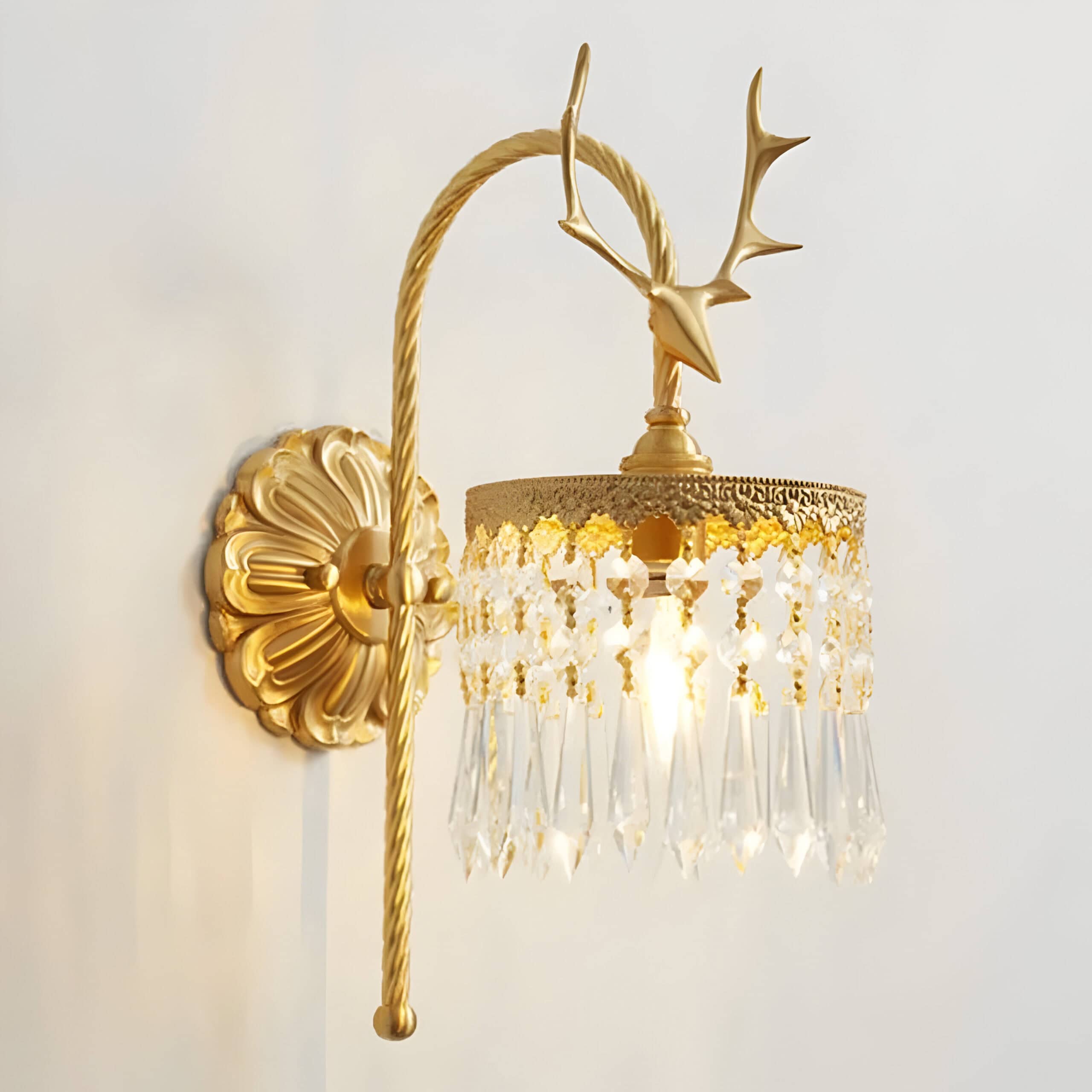 Elegant gold wall sconce with crystal embellishments, perfect for luxury interior decor or upscale boutique settings.