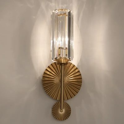 Luxurious crystal wall sconce with gold accents, elegant lighting fixture for modern interior decor, stylish and sophisticated design for upscale spaces.