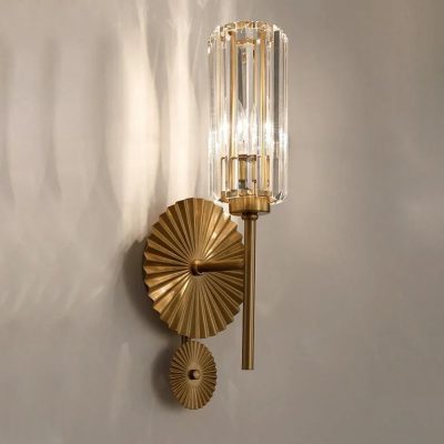 Elegant gold and crystal wall sconce with artistic design, perfect for luxury interiors and modern decor.