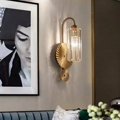 Elegant wall-mounted gold and glass light fixture in Monalisa Store interior with framed artwork and stylish decor, perfect for modern optical store aesthetics.