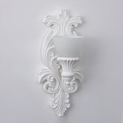Elegant white wall sconce with intricate carved details, perfect for stylish interior decor, available at Monalisa Store.