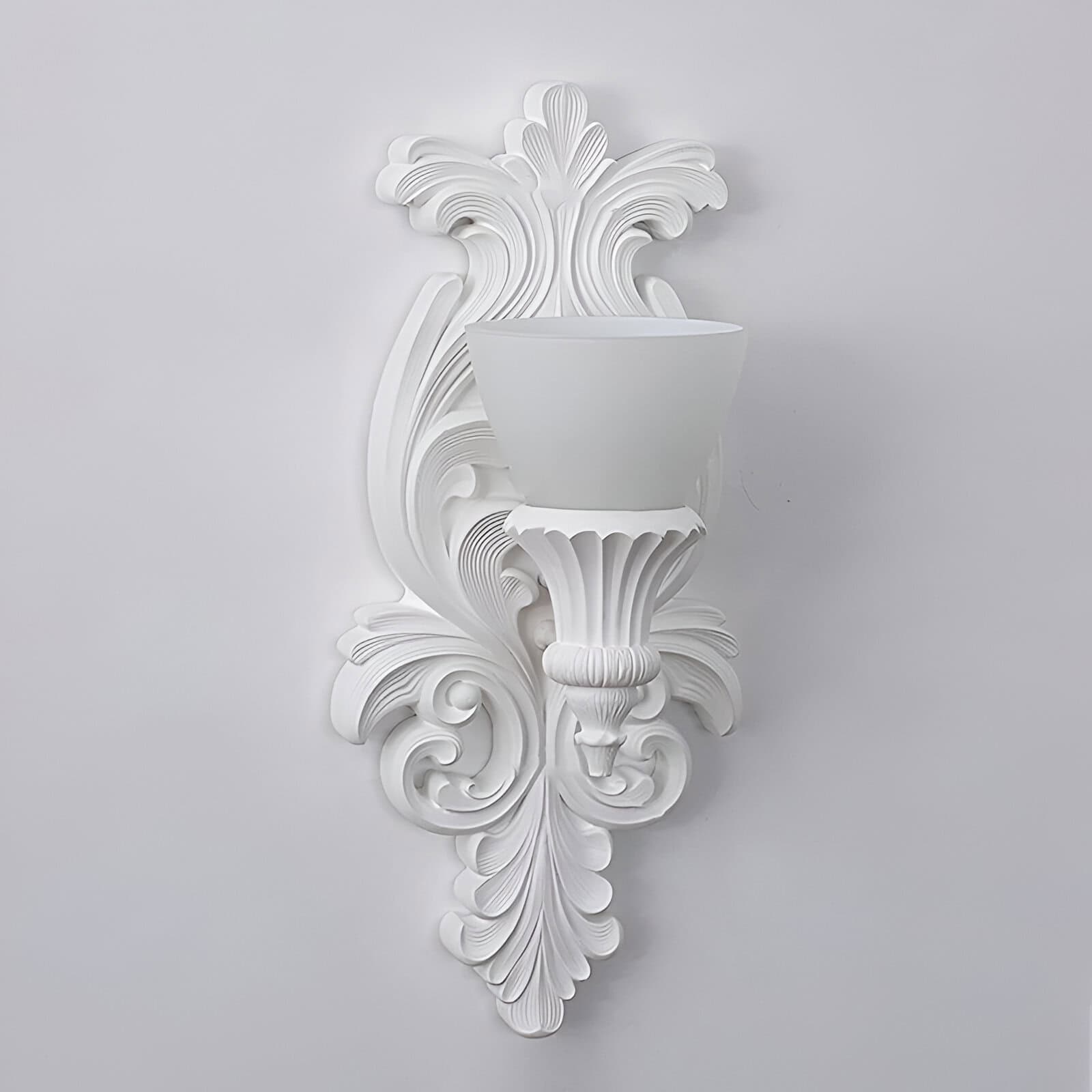 Elegant white wall sconce with intricate carved details, perfect for stylish interior decor, available at Monalisa Store.