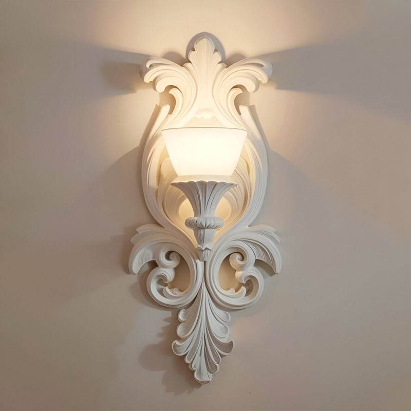 Elegant ornate white wall sconce with decorative carvings, perfect for luxurious interior lighting. Ideal for enhancing sophisticated spaces with classic and stylish ambiance.