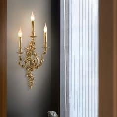 Luxurious gold wall sconce chandelier with candle-style bulbs, elegant decor for upscale interior design, perfect for enhancing the ambiance of a sophisticated space.