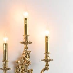 Elegant gold chandelier with candle-style light bulbs, luxurious design perfect for upscale interior decor and stylish lighting solutions for living rooms and dining areas.