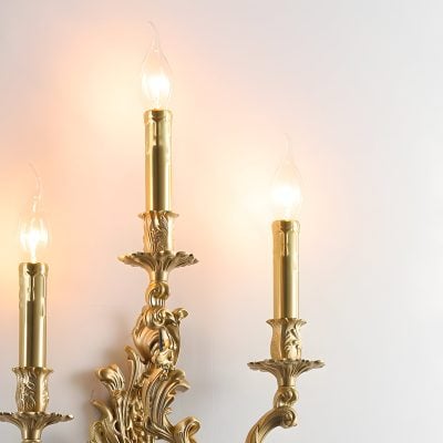 Elegant gold chandelier with candle-style light bulbs, luxurious design perfect for upscale interior decor and stylish lighting solutions for living rooms and dining areas.