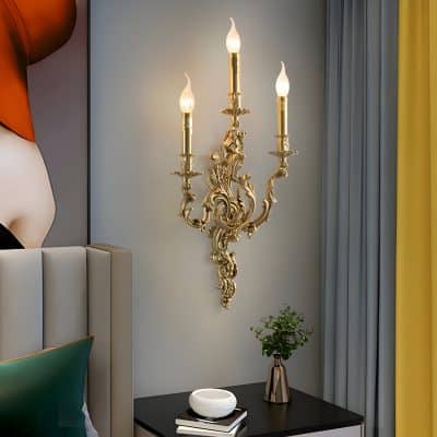 Gilded wall sconce with candle-style light bulbs, luxurious interior decor, elegant lighting fixture, suitable for sophisticated bedroom or living room, Monalisa Store luxury lighting design.