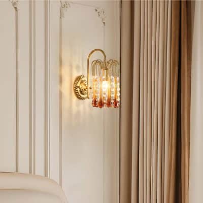 Elegant gold wall sconce with crystal accents for sophisticated interior decor.