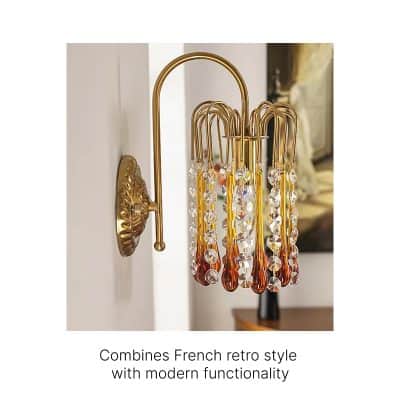 Golden vintage wall sconce with amber and crystal glass drops, perfect for luxurious bedroom or living room decor. Modern functionality meets French retro style in this elegant lighting fixture.