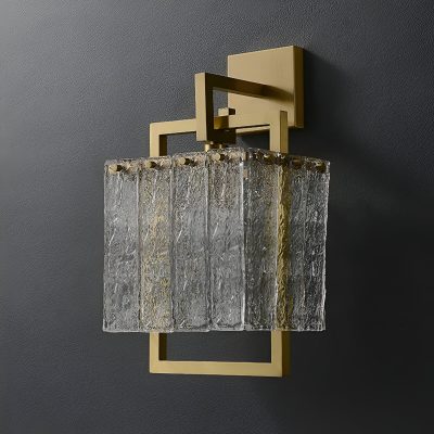 Elegant modern wall sconce with a gold geometric frame and textured glass shade, ideal for sophisticated interior lighting in living rooms, bedrooms, or hotel decor.