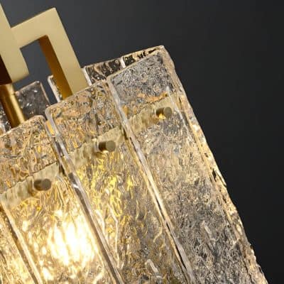 Intricate glass and gold chandelier lighting fixture with textured crystal details, elegant design, perfect for luxury interiors and high-end decor.