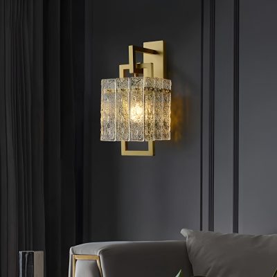 Elegant modern wall sconce with gold accents and textured glass shade, ideal for luxury home decor and interior lighting. Perfect for a stylish bedroom or living room setting.