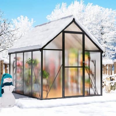 Greenhouse with snow-covered roof in winter, ideal for gardening and plant protection, featured on Monalisa Store's outdoor equipment collection, perfect for gardening enthusiasts seeking durable and versatile greenhouses.