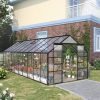Greenhouse for gardening and plant care at Monalisa Medical Store, outdoor gardening greenhouse with glass panels, perfect for plant cultivation and protection, located next to modern residential house.