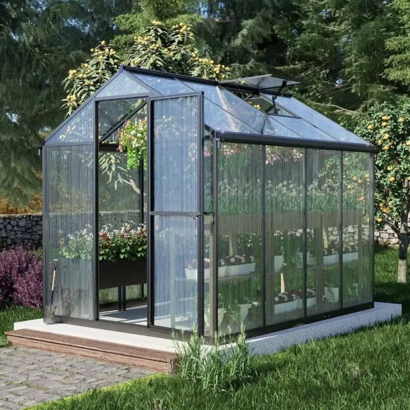 Modern glass greenhouse for gardening and plant care, featuring durable aluminum frame and transparent panels for optimal sunlight, ideal for outdoor plant cultivation.