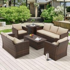 Comfortable outdoor wicker furniture set on a modern patio, ideal for garden relaxation and outdoor entertaining. Featuring a sofa, armchairs, and coffee table with plush cushions, perfect for a stylish backyard sitting area.