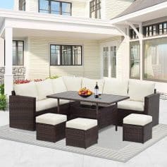 Outdoor patio furniture set featuring a corner sofa, stools, and a table with a fruit bowl and wine bottle, designed for stylish outdoor living and relaxation.