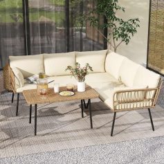 Stylish outdoor seating area with modern sofa, rattan chair, and coffee table, perfect for relaxing at Monalisa Store. Elegant decor with plants, neutral tones, and natural light.