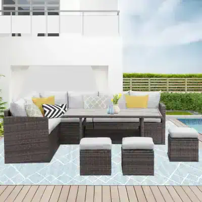 Bright outdoor patio furniture set with wicker sofas, ottomans, and a dining table, perfect for outdoor living and entertaining. Modern design with cushions, ideal for sunny garden or poolside relaxation.