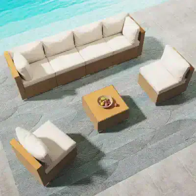 Elegant outdoor furniture set featuring a spacious wicker sofa and armchairs with plush white cushions, perfect for relaxing by the poolside or patio.