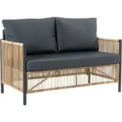 Modern rattan and metal sofa with black cushions, perfect for outdoor or indoor relaxation, stylish furniture for homes and gardens.