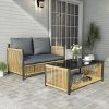 Modern outdoor furniture set at Monalisa Store, featuring a stylish wicker sofa with cushions and a black glass-top coffee table, perfect for garden or patio decor, showcasing high-quality durable materials.