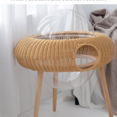 Natural rattan pet bed with transparent bubble cover, eco-friendly and durable, ideal for comfortable and stylish pet relaxation, perfect for modern households.