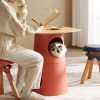 Fluffy cat inside modern pet furniture cone, cozy home reading scene, stylish pet furniture design, Monalisa Store pet accessories, premium quality cat furniture for stylish homes.